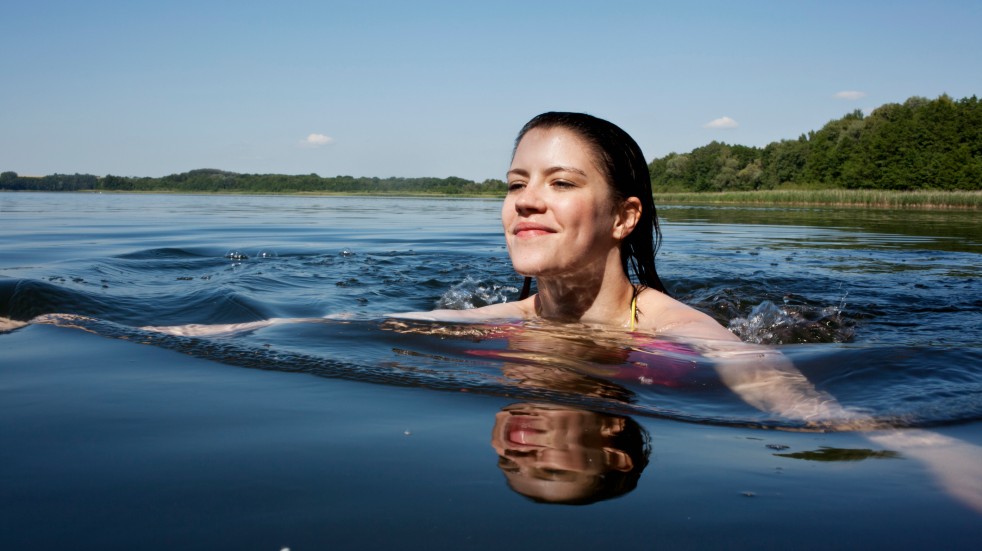 Woman swimming in a lake